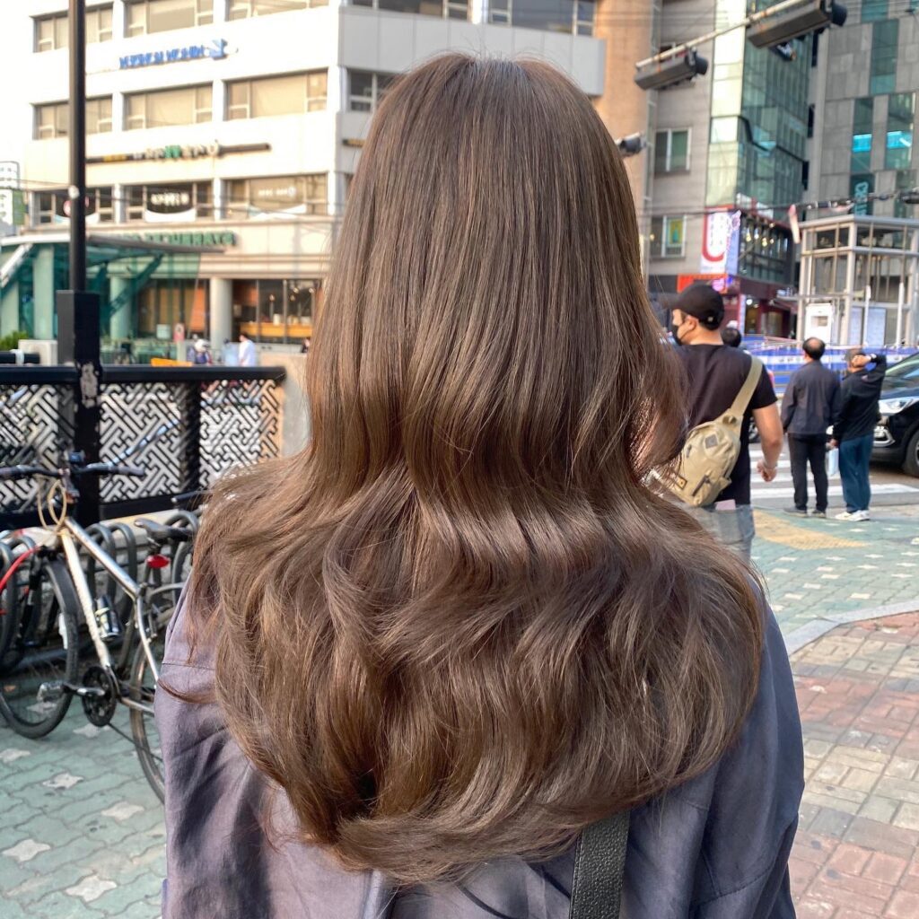 Sun-Kissed Softness: Bleached Sand Beige Color by Seoul Hair Salon 1 woman ash brown long hair